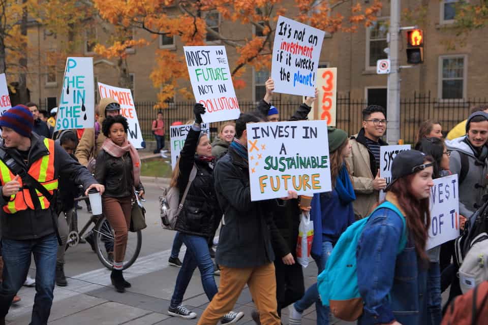 Students attend a UofT350 divestment protest. CC Flickr by Milan Ilnyckyj.